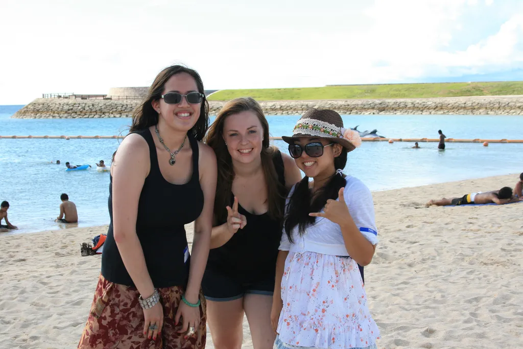 Students enjoying the beach on a sunny day in Chatan, Okinawa, Japan
